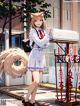 A girl in a school uniform standing next to a mailbox.