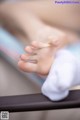 A close up of a person's foot on a table.